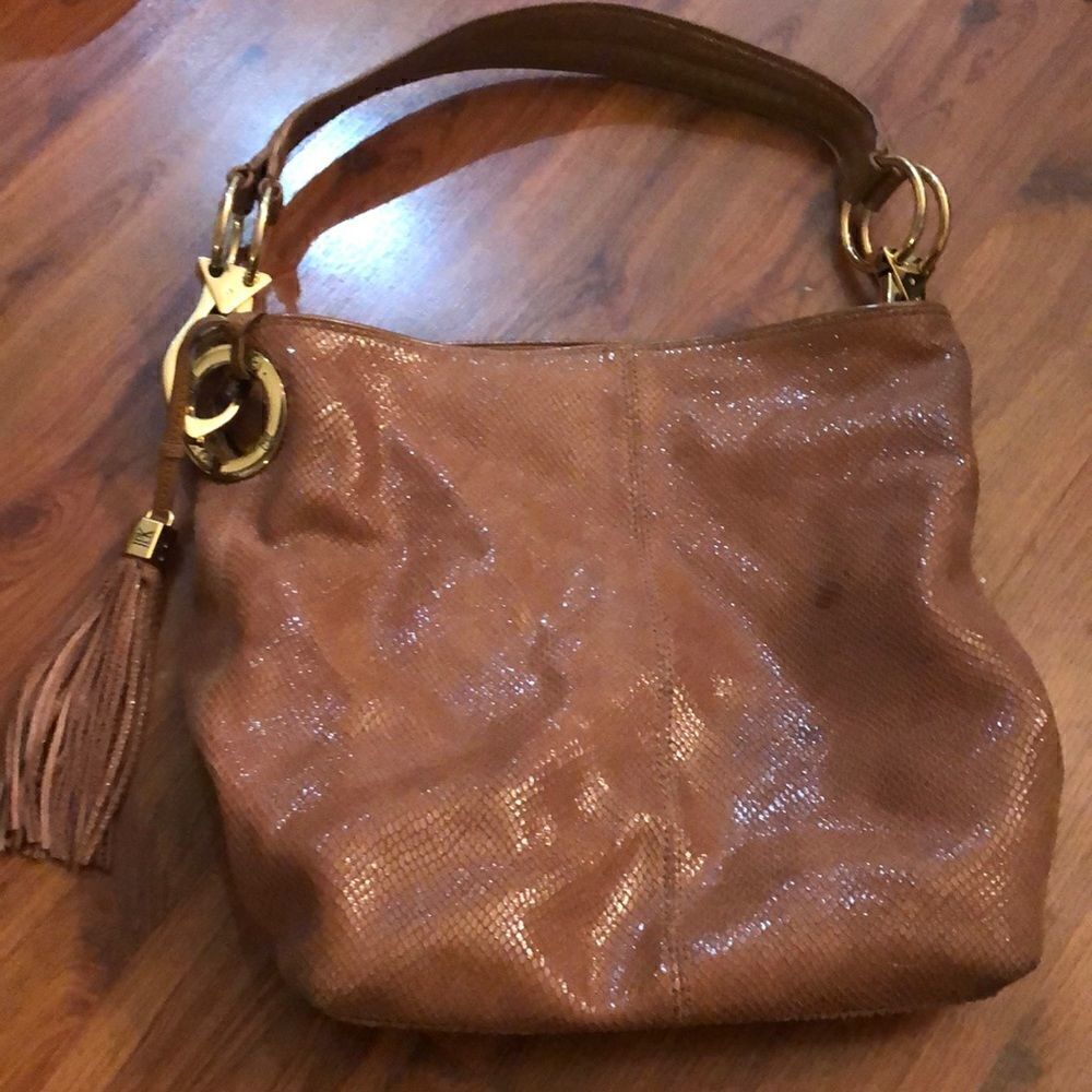 JPK Paris Leather handbag with gold Hardware and tassel.